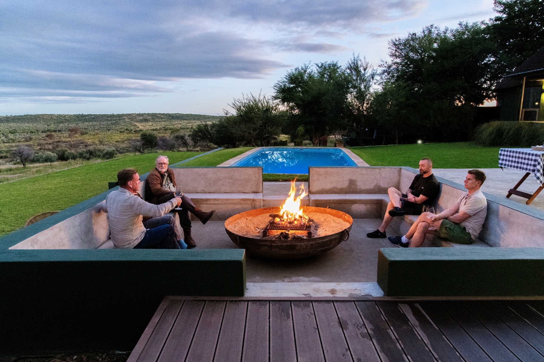 Guests around the fire pit at sundown